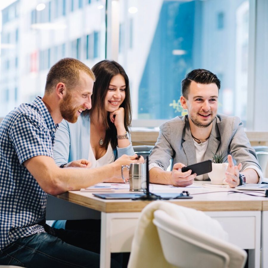 cheerful-colleagues-discussing-new-work-strategy_23-2147707806