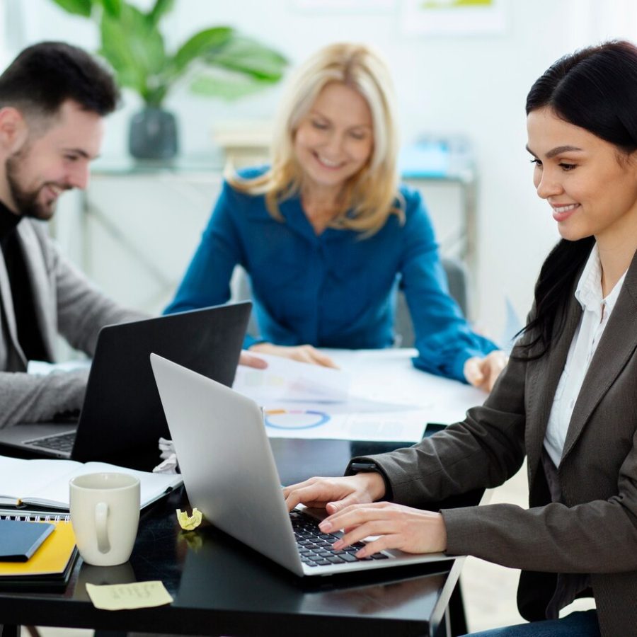 medium-shot-happy-people-working_23-2149300698